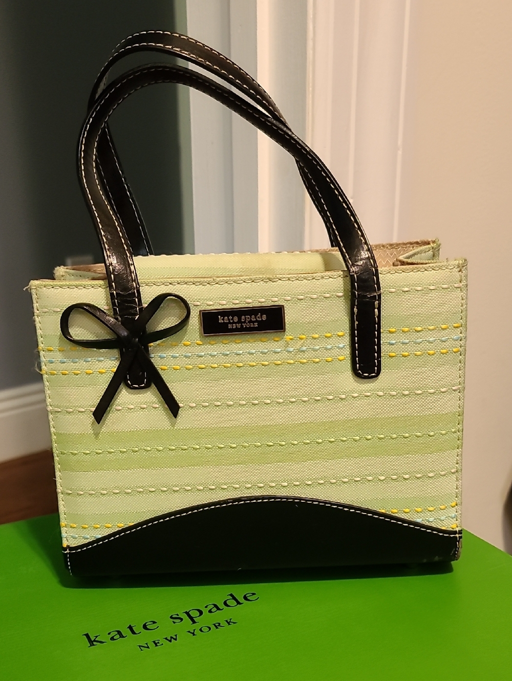 Kate SPADE  light green striped tote with black trim